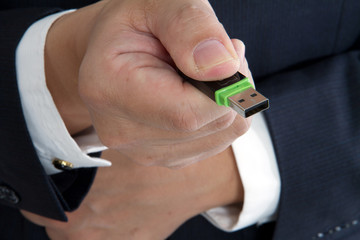 business man with an usb disk  on hand