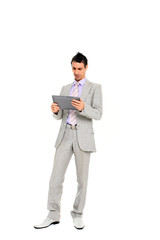 young business man standing using a tablet