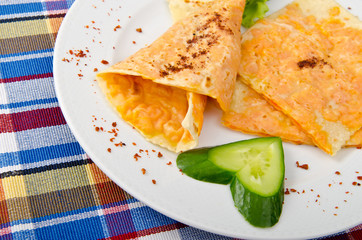 Pumpkin stuffed panckes in the plate