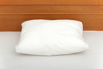 Fototapeta na wymiar Pillow in an empty bed.