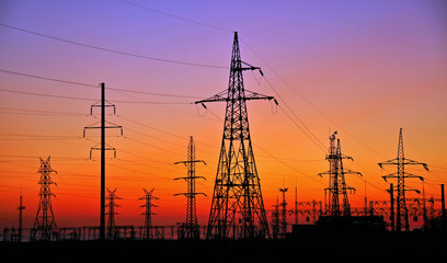 ELECTRICITY PYLONS AGAINST SUNSET