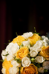 White and yellow roses in a bridal bouquet