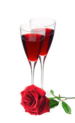 Two glass with red wine and red rose isolated on white