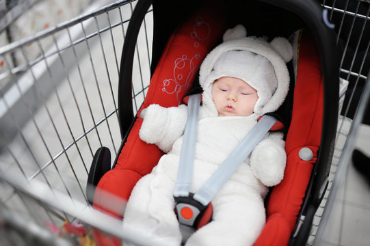 Newborn Girl In Car Seat In A Shopping Cart