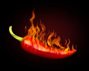 Keuken spatwand met foto Red hot chili peper op zwarte achtergrond met vlam © Vitaly Korovin