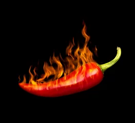 Wall murals Hot chili peppers red hot chili pepper by fire on a black background