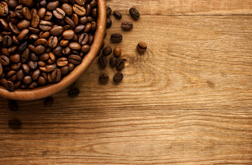 Bowl of coffee. View from above on a wooden surface.