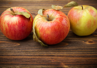 red apples on wooden table