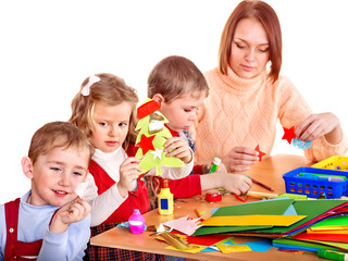 Fototapeta premium Kindergarden teacher with children.