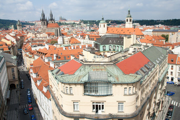 Naklejka na ściany i meble Top view cityscape on old Prague district, tiled mansard roofs