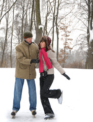 Fototapeta na wymiar young couple in winter skate rink