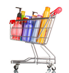shopping cart with detergent bottles isolated on white
