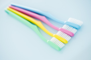 Four multicolored toothbrushes