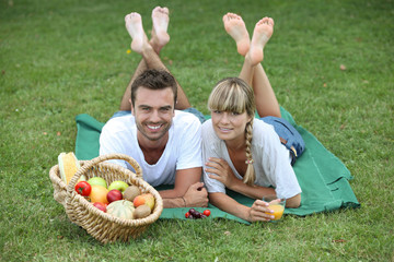 Couple enjoying picnic in park