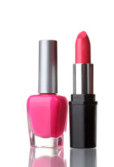 Obraz premium Pink lipstick and nail polish isolated on white background