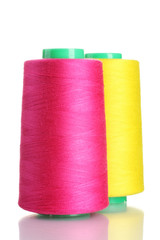 Bobbins of thread isolated on white