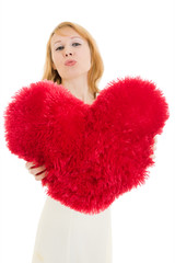 A woman holds a heart in his hands on a white background.