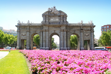 Naklejka premium Madrid Puerta de Alcala with flower gardens