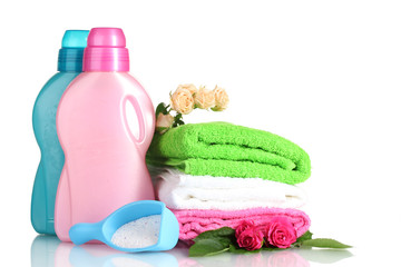 Detergent with washing powder and towels isolated on white