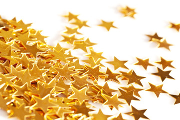 Décoration de Noël, étoiles dorées sur fond blanc, décor de fêtes pour la table du réveillon, nouvel an 2025