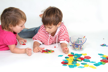 two children playing studio shot