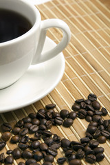 Coffee beans and the white cup