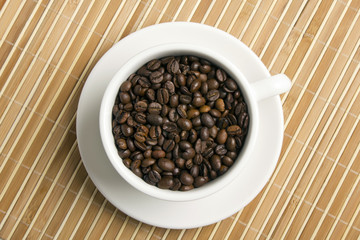 Coffee beans in the white cup