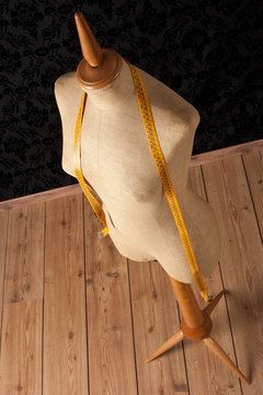 tailor mannequin with tape measure