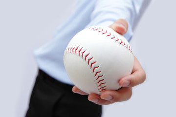 Business man hand holding a baseball