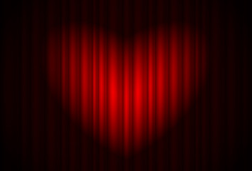 Stage with red curtain and spotlight great, heart-shaped