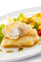 Fish dish - fried fish fillets and vegetables