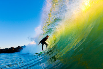 Surfer on Wave at Sunset