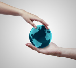 Conceptual symbol of the Earth with human hands