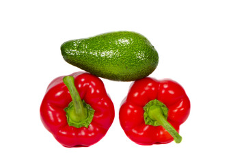 isolated green avocado and two peppers
