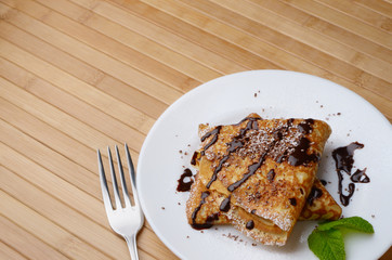 Crepes with chocolate sauce