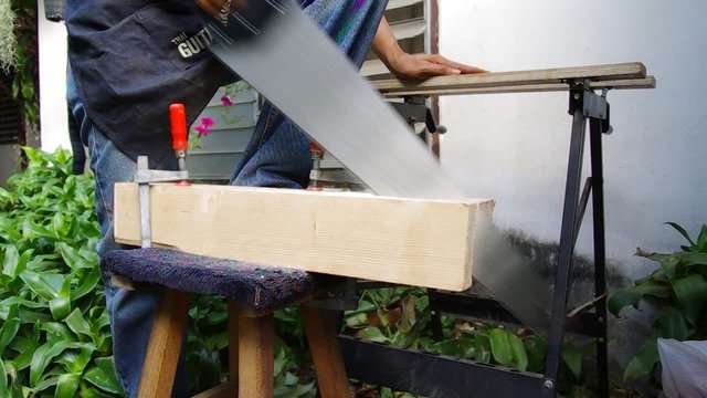 hand saw on guitar wood