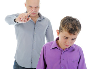 Strict father punishes his son - 37330799