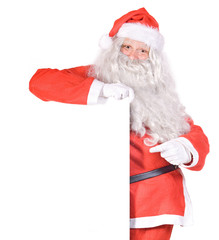 Naklejka premium Santa Claus holding a blank sign
