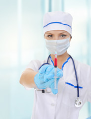 nurse with a syringe in his hand.