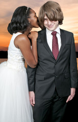 Woman whispering a secret to a man