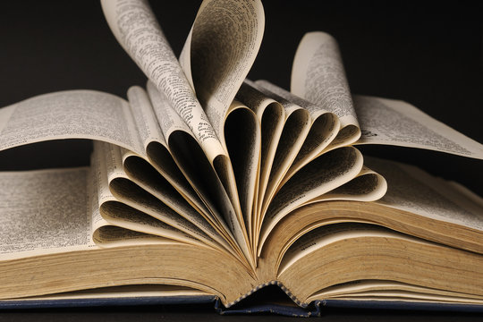 pages of dictionary isolated on black background