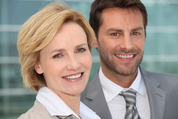 Businessman and woman smiling