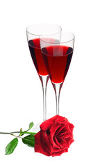 Two glass with red wine and red rose isolated on white