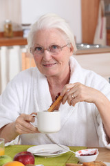 grandmother having breakfast