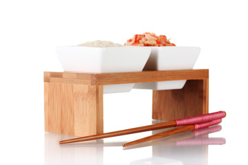 rice and shrimp in bowls on wooden stand isolated on white