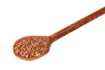 Wooden spoon with raw buckwheat isolated on white