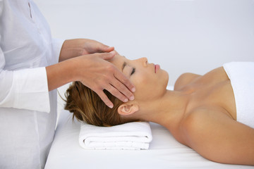 Fototapeta na wymiar Woman being given head-massage