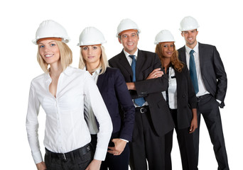 Female civil engineer standing with her team
