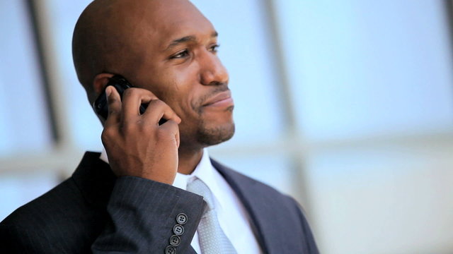 African American Businessman in Close up With Smartphone