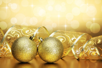 Christmas baubles, ribbon and bokeh background